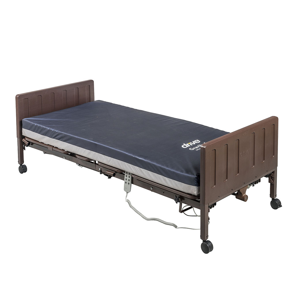 Hospital bed with rails